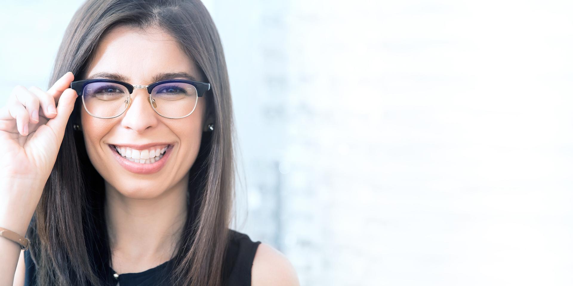 Woman with glasses smiling