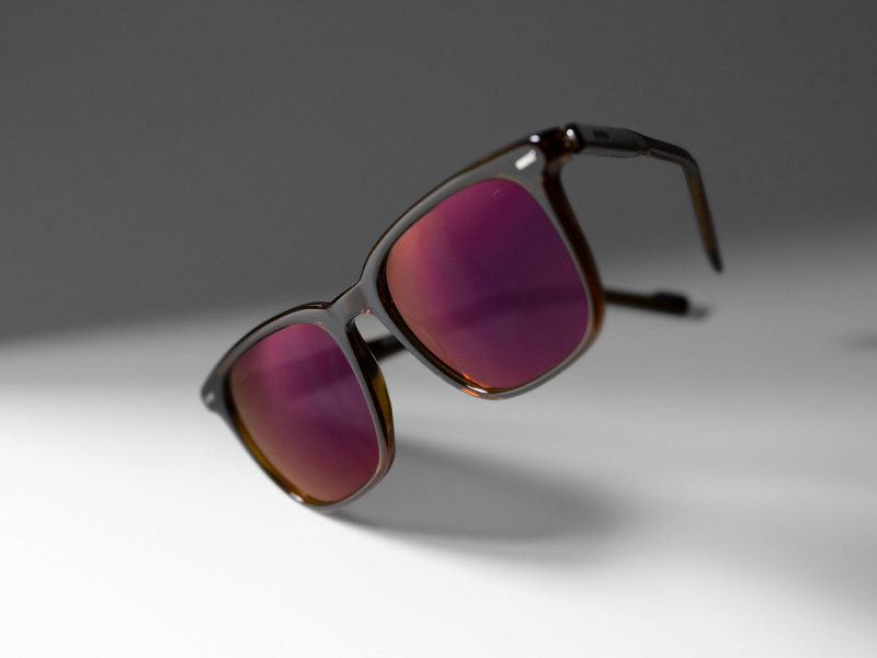 Покриття для лінз ZEISS DuraVision Gold UV на тонованих лінзах для сонцезахисних окулярів кольору Burgundy (бордо).