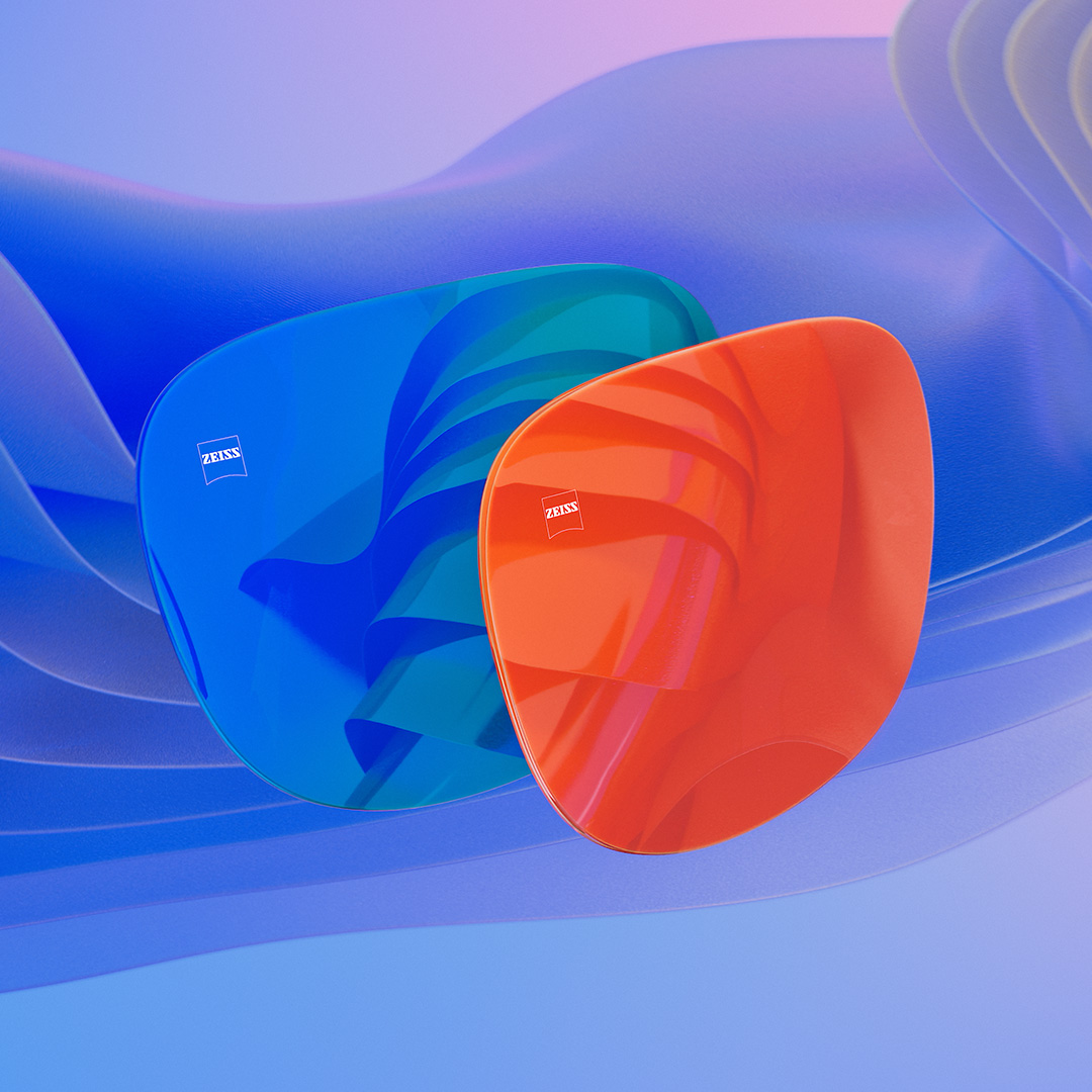 Згенероване комп'ютером зображення лінз для сонцезахисних окулярів із синім та оранжевим дзеркальними покриттями на передній поверхні.