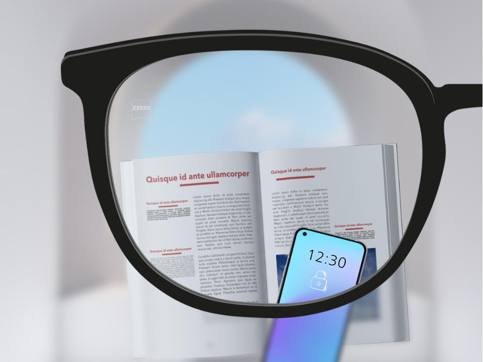 Зображення при погляді крізь лінзи ZEISS Single Vision SmartLife зі смартфоном та книгою; зображення повністю чітке по всій лінзі.
