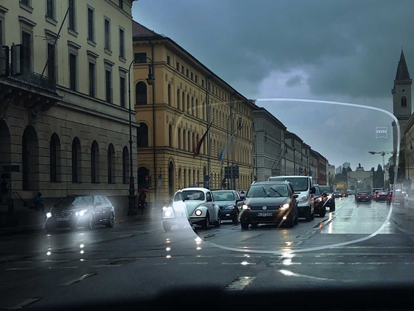 Рисунок ілюструє погану видимість на вулиці в умовах недостатнього освітлення. Вид на салон автомобіля крізь окулярні лінзи. 
